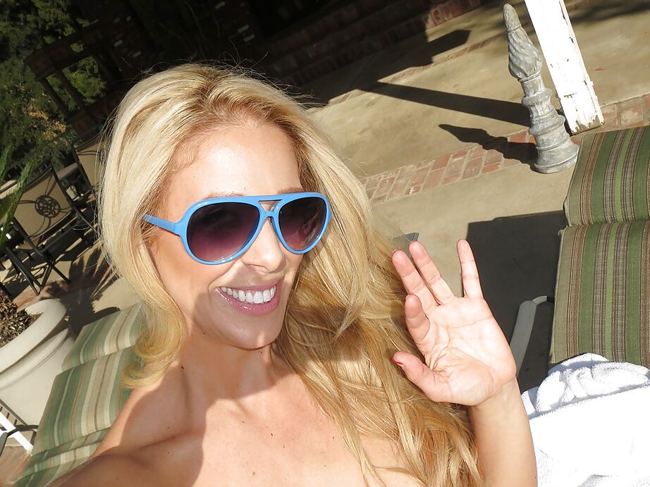 16P Outdoor posing scene featuring Cherie Deville, showing off in glasses