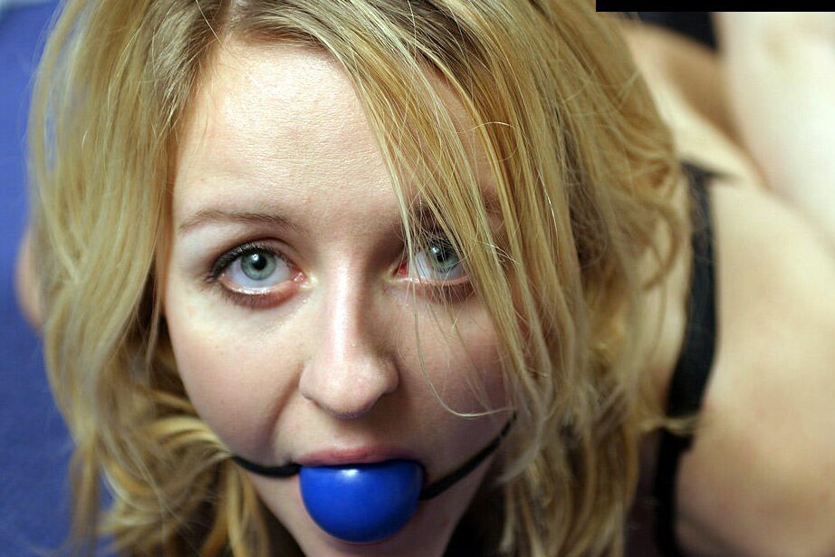 12P Blonde chick in black underwear and rope bindings spits out ball gag