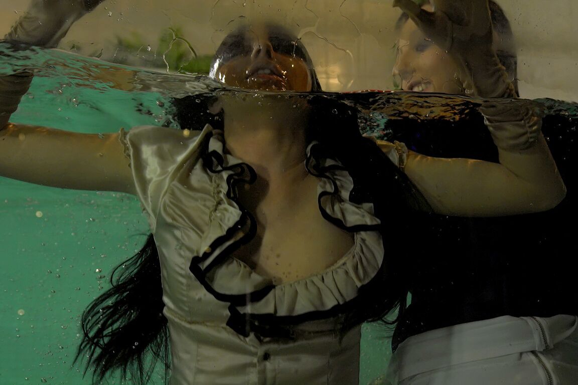 15P Fully clothed females expose tits and twats by jumping into an indoor pool