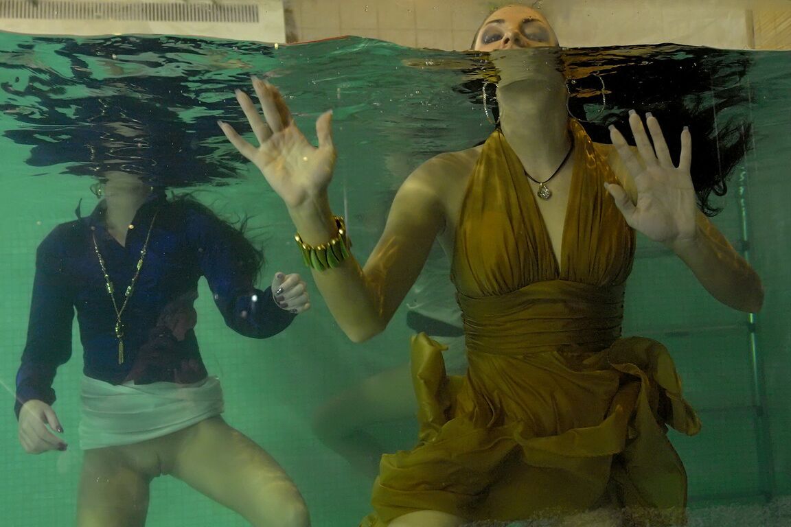 15P Fully clothed females expose tits and twats by jumping into an indoor pool