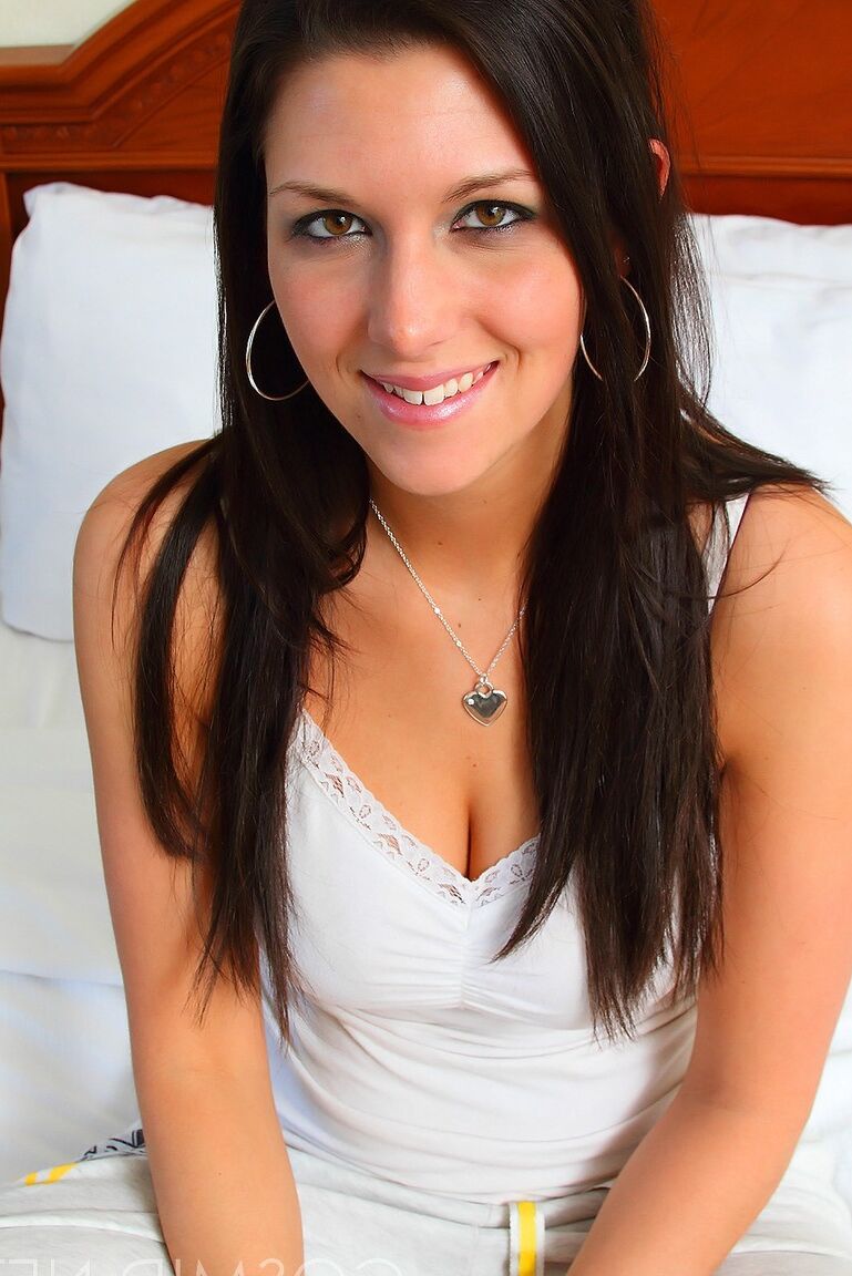 16P Brunette amateur Adrian Fletcher uncups her nice tits before removing a thong