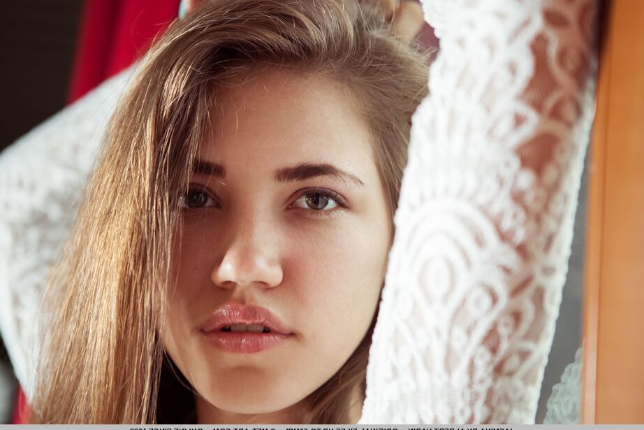 18P Teen model Jasmina reveals her tight slit while getting naked on a chair