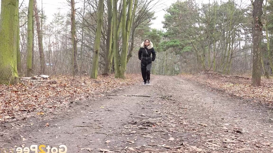 15P Solo girl Natasha Ink squats for a pee on a dirt road in glasses and a coat