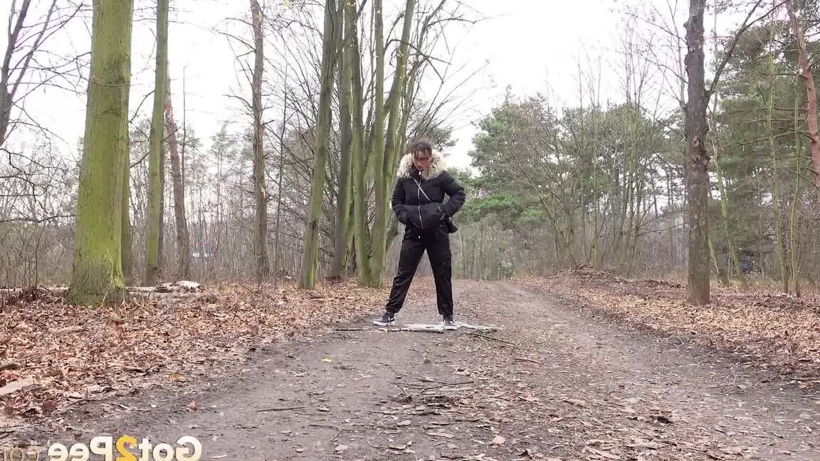 15P Solo girl Natasha Ink squats for a pee on a dirt road in glasses and a coat