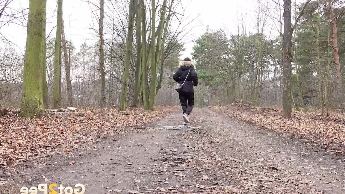 15P Solo girl Natasha Ink squats for a pee on a dirt road in glasses and a coat