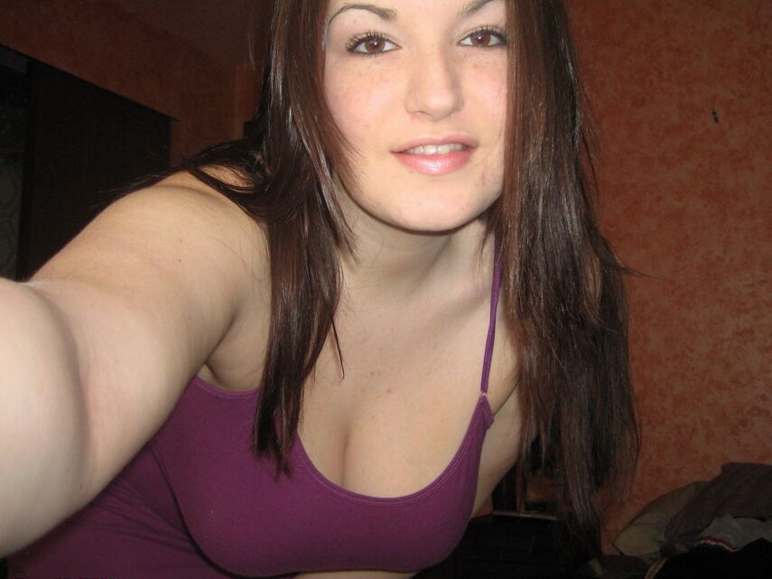 12P Kayla pulls down the top of her dress to expose her massive tits