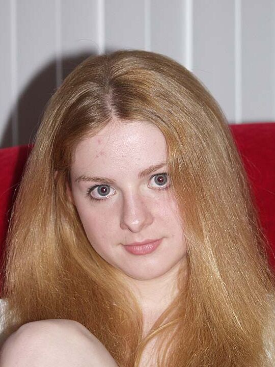 16P Fair skinned redhead Heidi displays her big naturals and twat at the same time