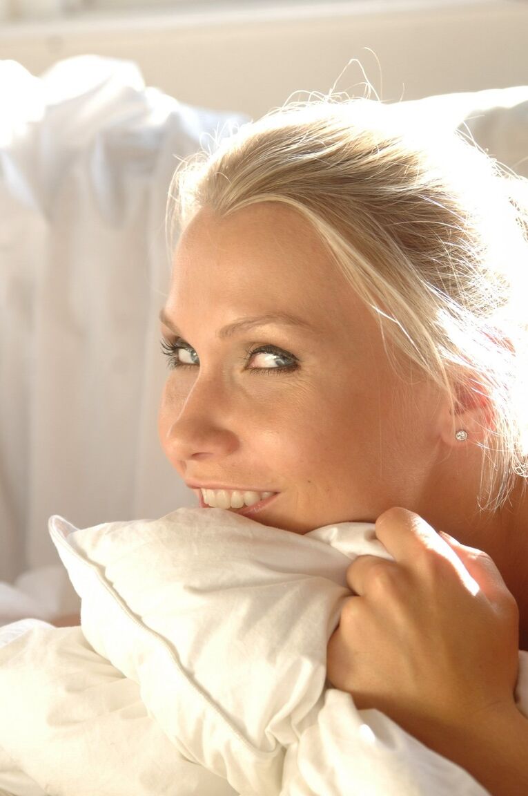 12P Blonde glamour model Michaela sets her from tits free of a lingerie on a couch