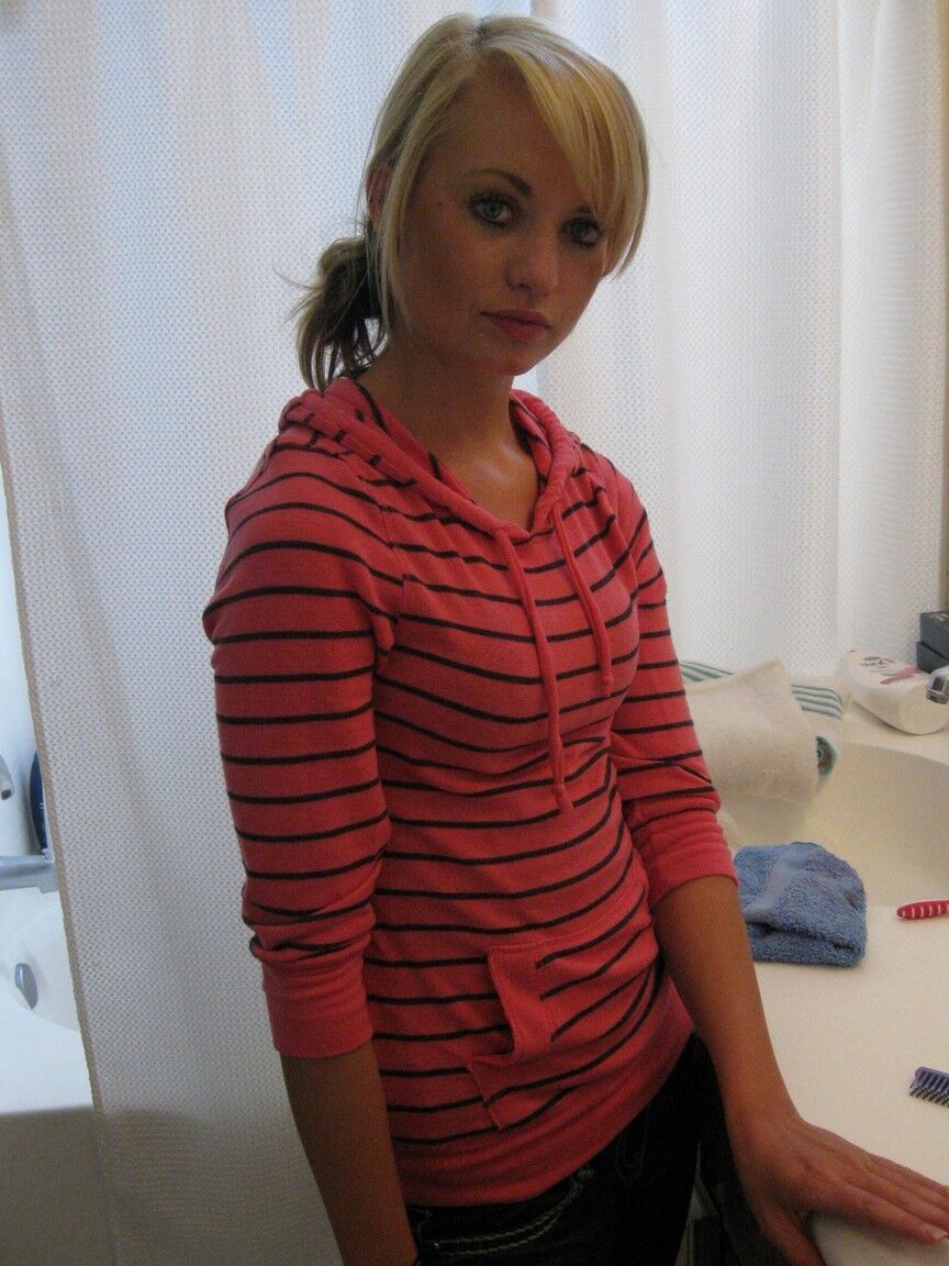 16P Blonde amateur Tiny Tiff sports a whale tail while doing her hair in a mirror