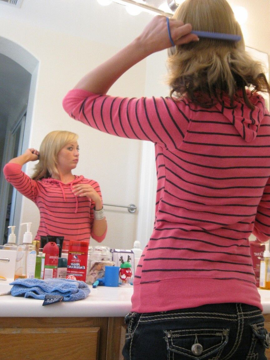 16P Blonde amateur Tiny Tiff sports a whale tail while doing her hair in a mirror