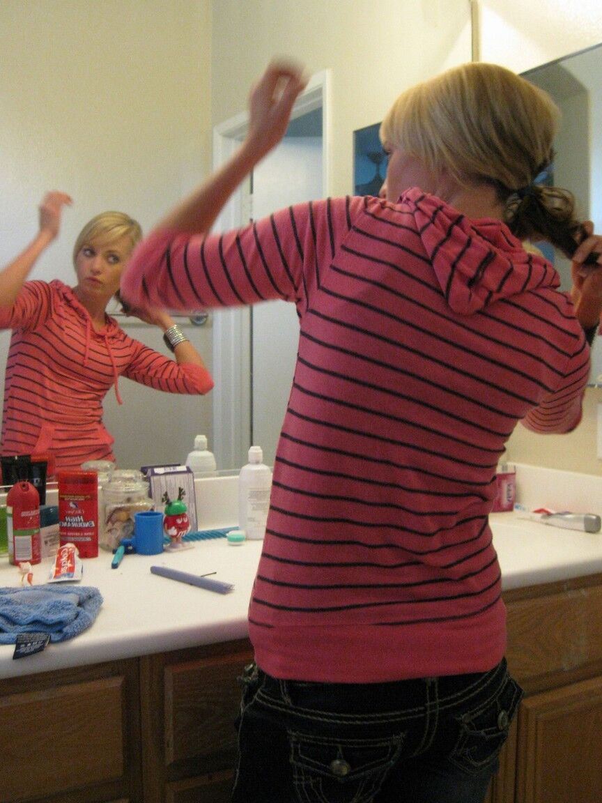 16P Blonde amateur Tiny Tiff sports a whale tail while doing her hair in a mirror