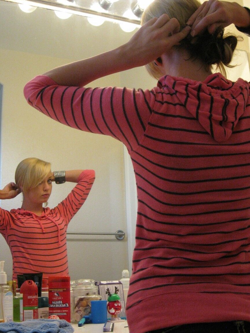 16P Blonde amateur Tiny Tiff sports a whale tail while doing her hair in a mirror