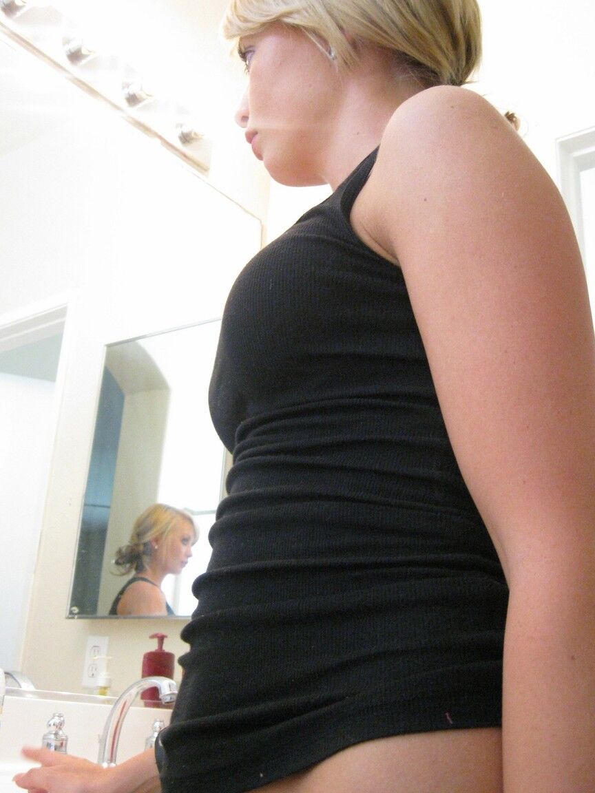 16P Blonde amateur Tiny Tiff sports a whale tail while doing her hair in a mirror