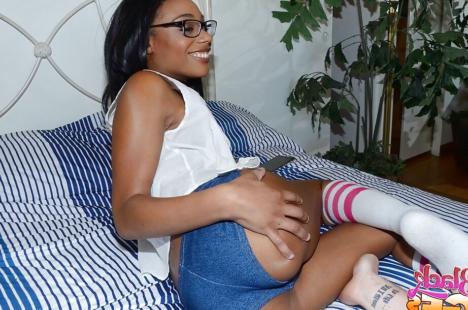 12P Glasses wearing black babe Bella Star showing off round ass in short shorts