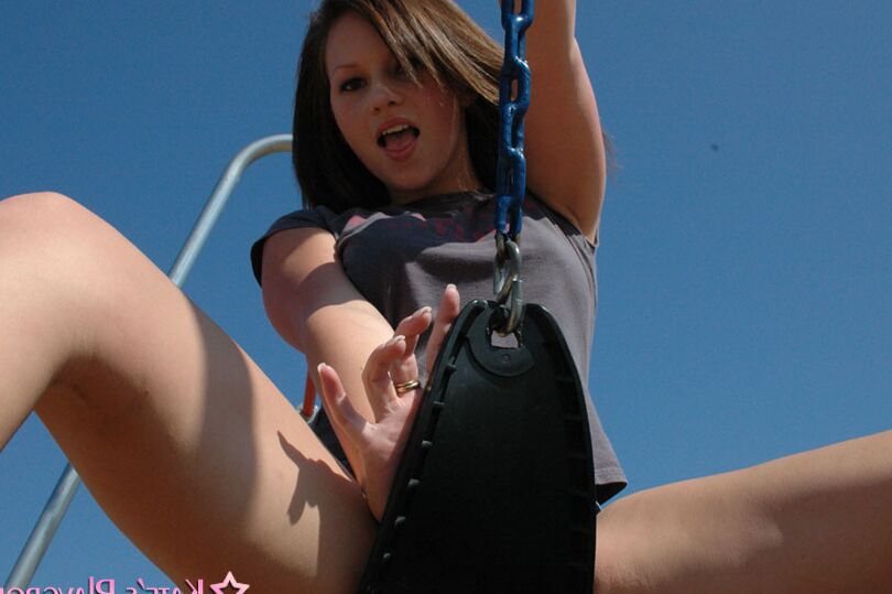 12P Teen amateur takes a swing on swing set in short denim shorts