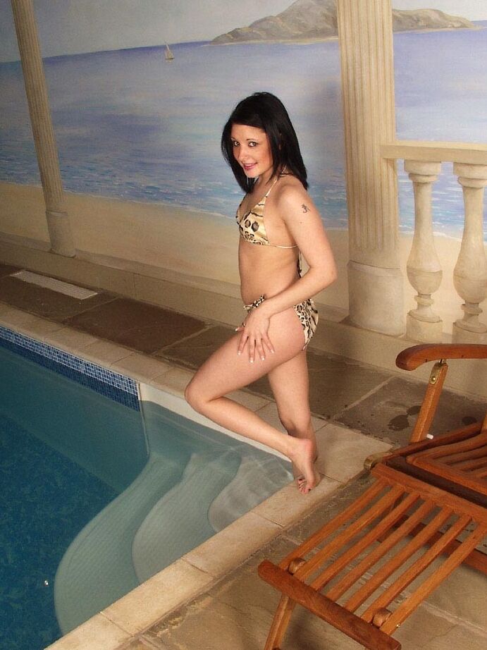 21P Sinful British babe Donna strips her leopard bikini in the pool & masturbates