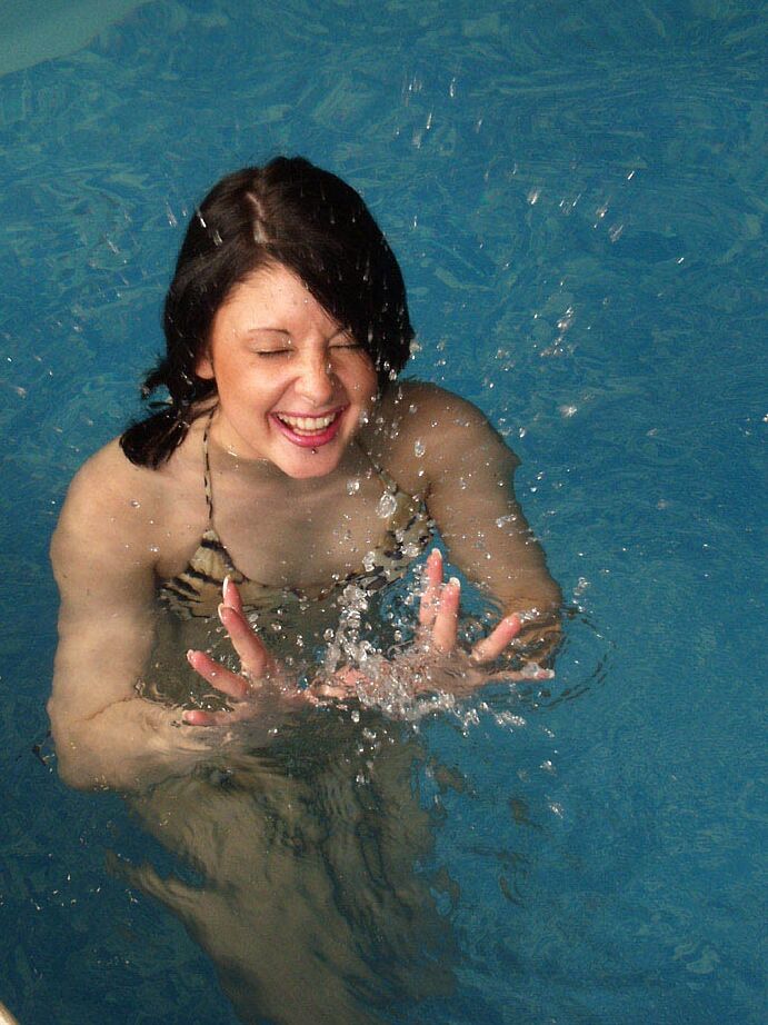 21P Sinful British babe Donna strips her leopard bikini in the pool & masturbates