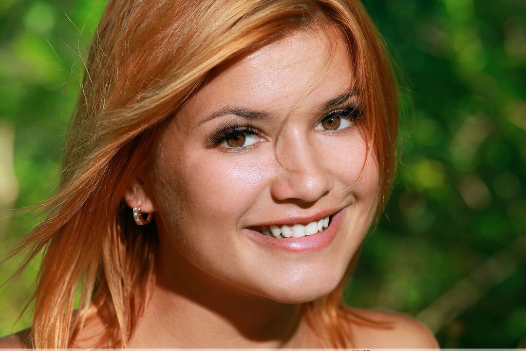 16P Beautiful redhead Dina P gets completely naked on blanket at the tree line
