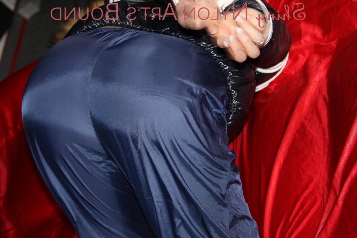 16P Sonja being tied, gagged and hooded on a shiny nylon bed with ropes and a
