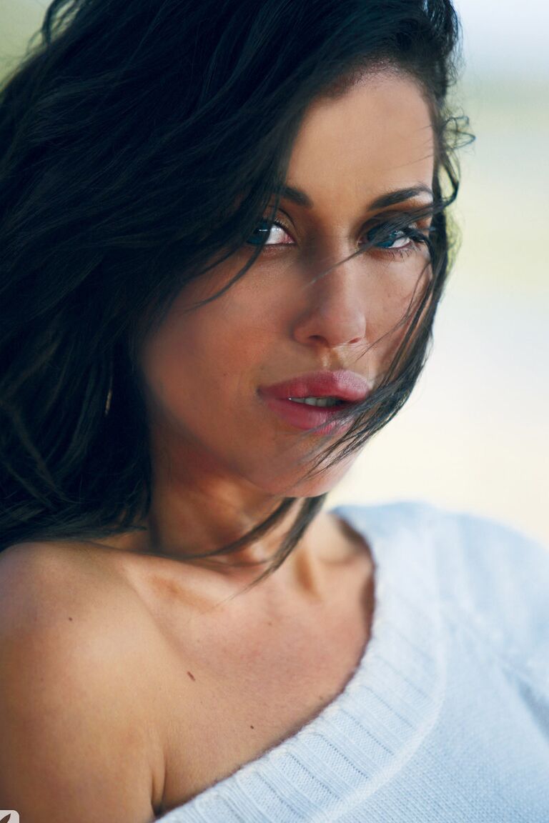 11P Glamorous Lithuanian model Sonia Sanders poses topless on the sandy beach