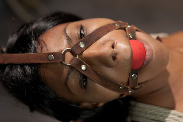 10P Restrained black girl is penetrated by a redheaded dyke in a dungeon