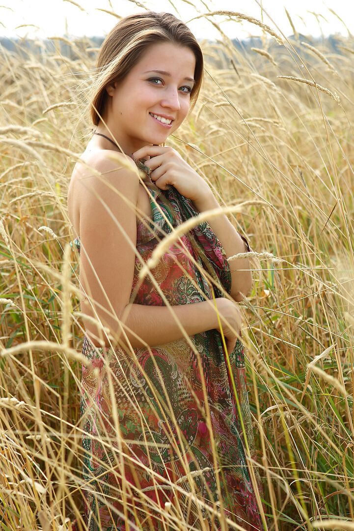 12P Hard nippled beauty undressing to spread naked in the long grass
