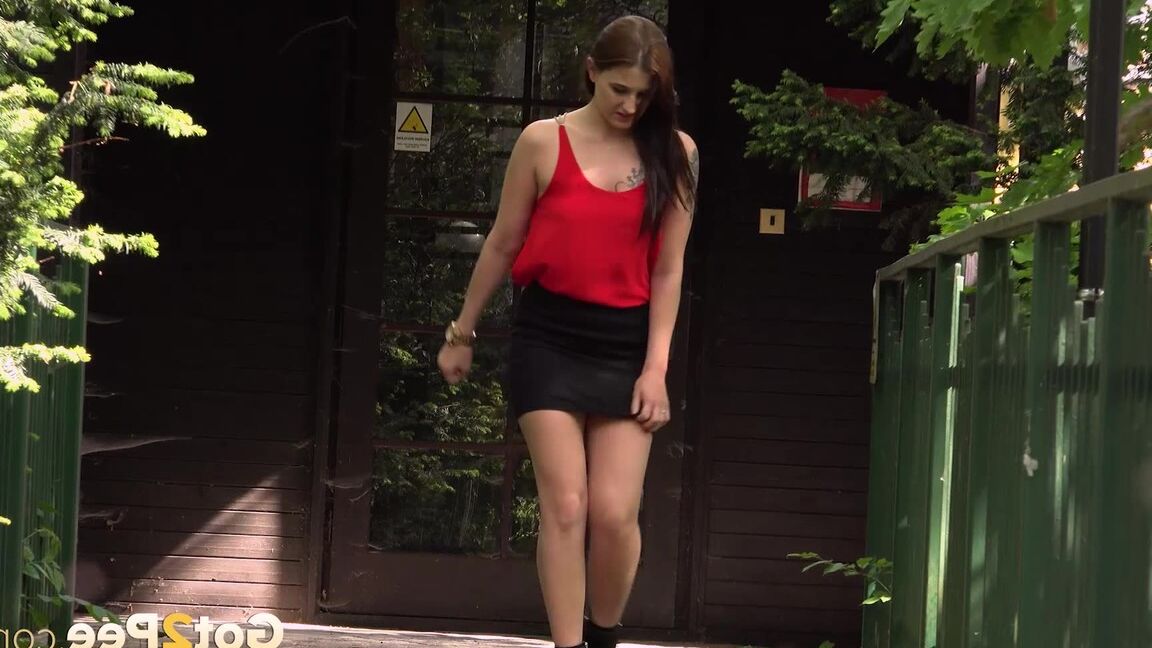 15P Distressed girl Dreka squats to pee on a path in woods with the loo locked up