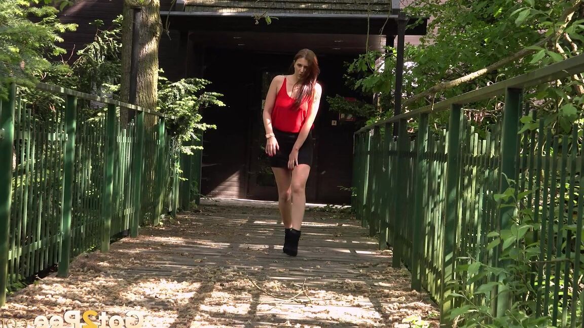 15P Distressed girl Dreka squats to pee on a path in woods with the loo locked up