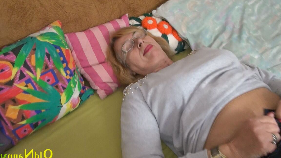 21P Wild granny Jitka strips her clothes off and fucks her muff with an orange toy