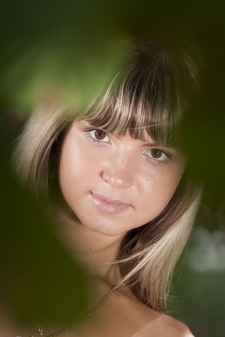 17P Brazen little cutie Gina on her knees naked in the grass showing her tiny kit