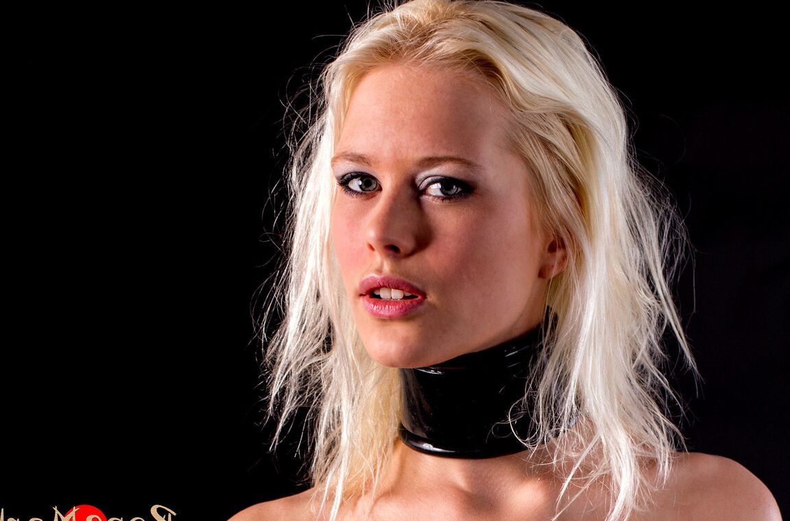 16P Blonde submissive is bound with rope before being suspended in the air
