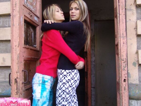10P Young lesbians Laura and Katrina kiss on the lips while fully clothed