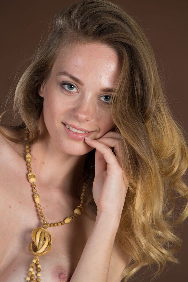 16P Slim teen girl with a pretty face models in her bare feet with no clothes on