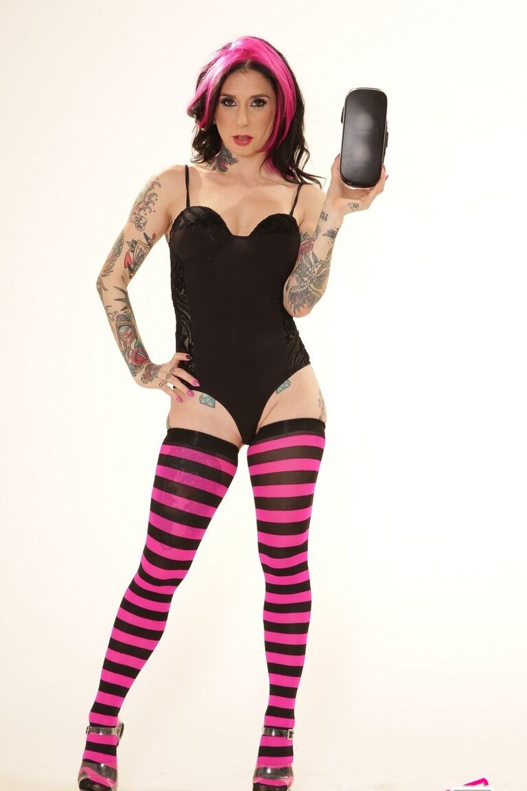 21P Inked wife in a bodysuit Joanna Angel poses with a VR set in her hands