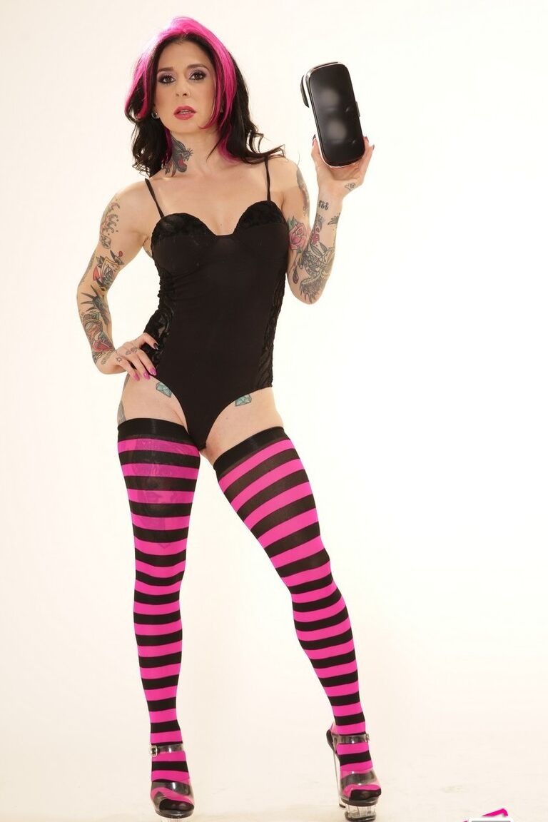 21P Inked wife in a bodysuit Joanna Angel poses with a VR set in her hands