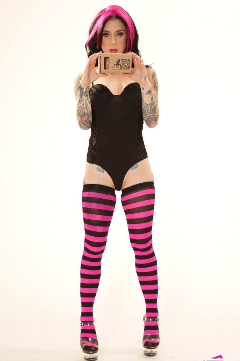 21P Inked wife in a bodysuit Joanna Angel poses with a VR set in her hands
