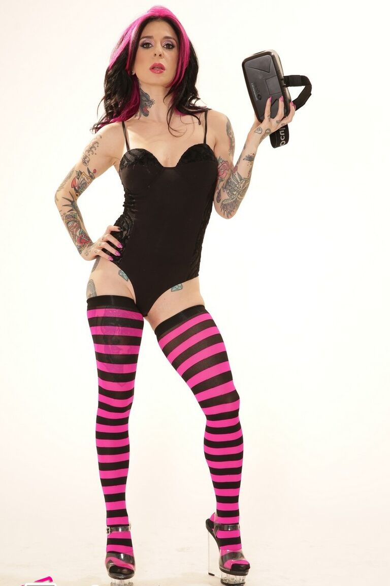 21P Inked wife in a bodysuit Joanna Angel poses with a VR set in her hands