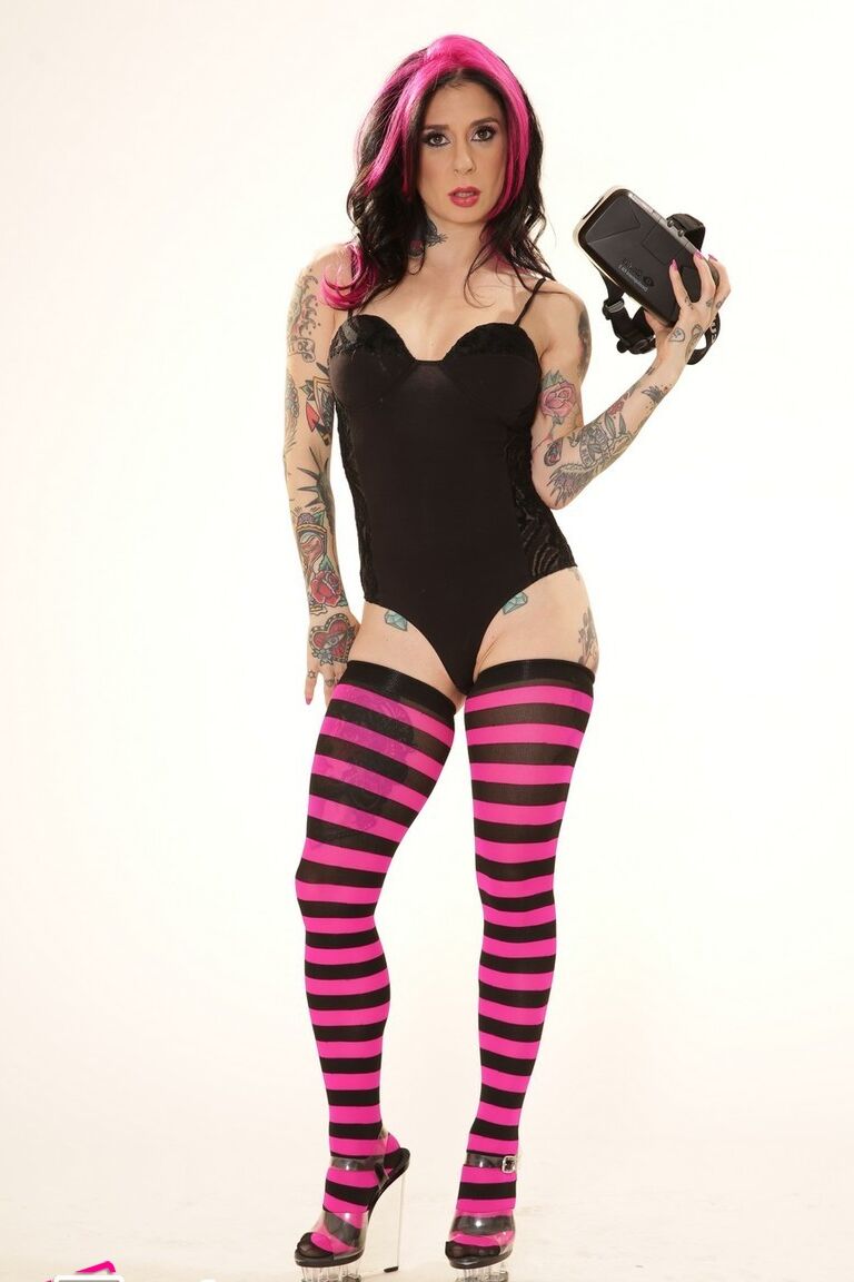 21P Inked wife in a bodysuit Joanna Angel poses with a VR set in her hands