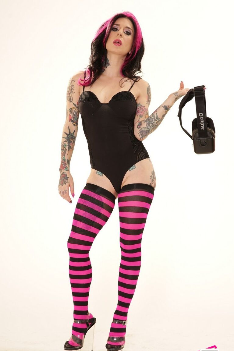 21P Inked wife in a bodysuit Joanna Angel poses with a VR set in her hands