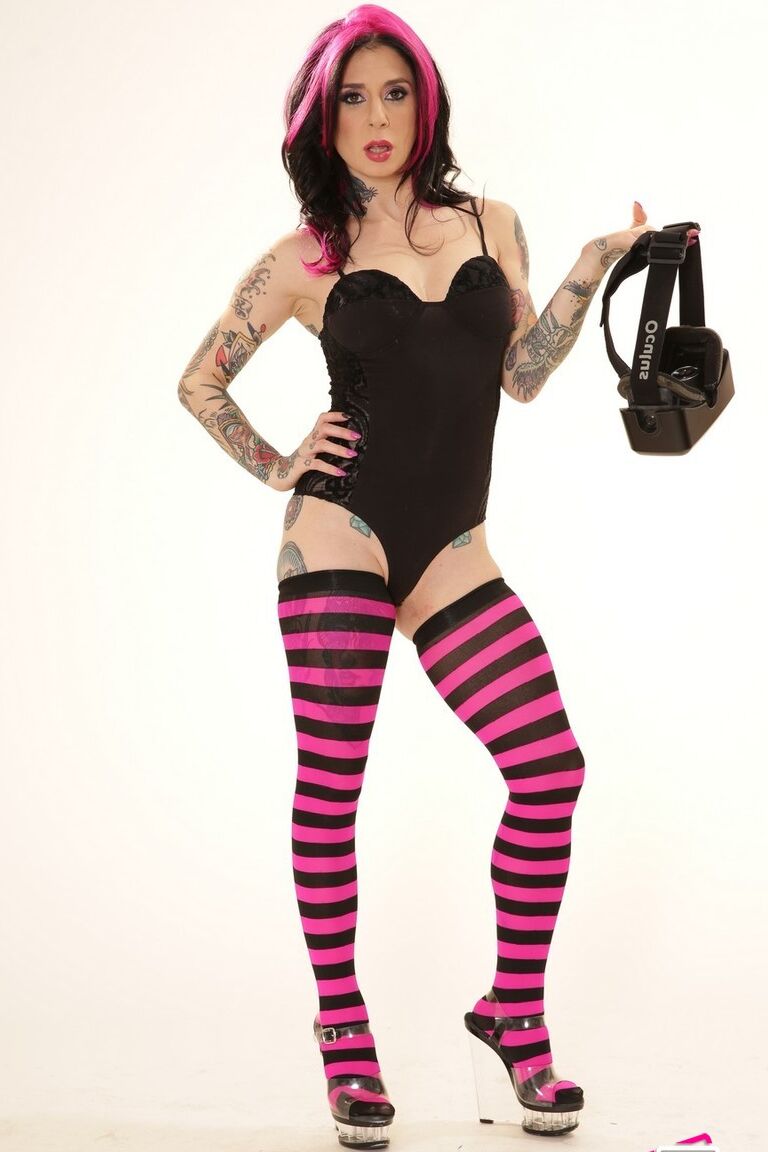 21P Inked wife in a bodysuit Joanna Angel poses with a VR set in her hands