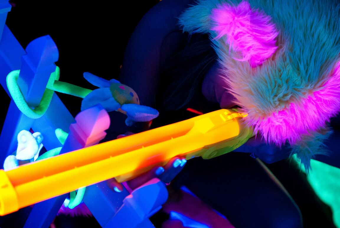 21P Cute pornstar with small tits Dani Daniels touches her twat in a neon setting