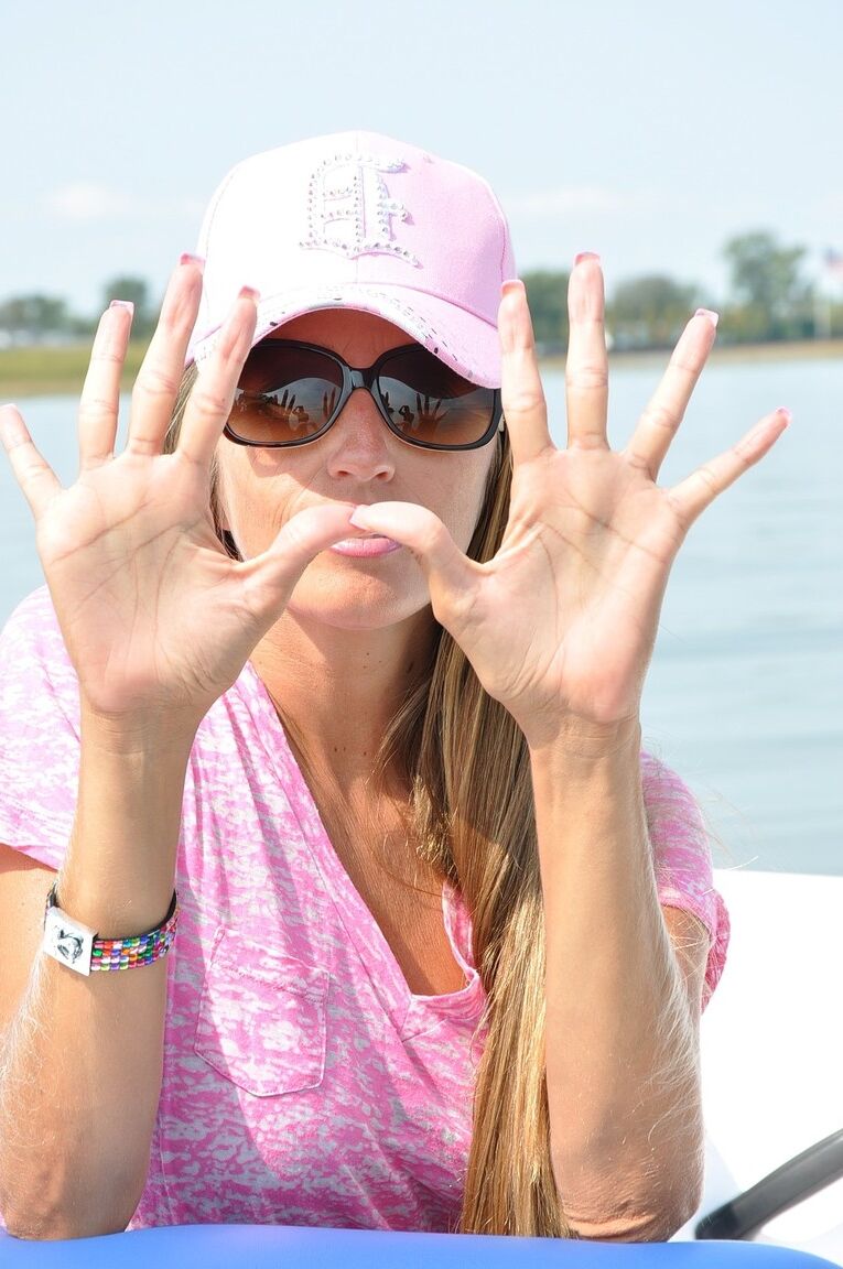 21P Amateur babe Lori Anderson showing off her long fingers and nails on a boat