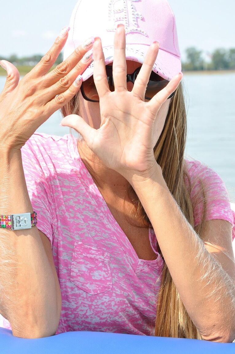 21P Amateur babe Lori Anderson showing off her long fingers and nails on a boat