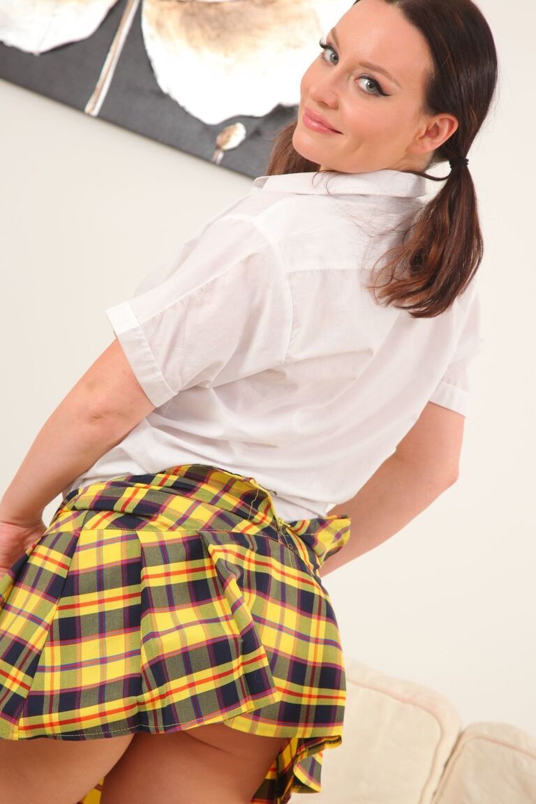 21P Pigtailed schoolgirl Carla undresses before posing in white panties and socks