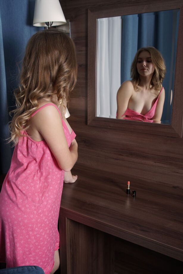 16P Sweet teen Dina Divine gets naked while looking at a mirror
