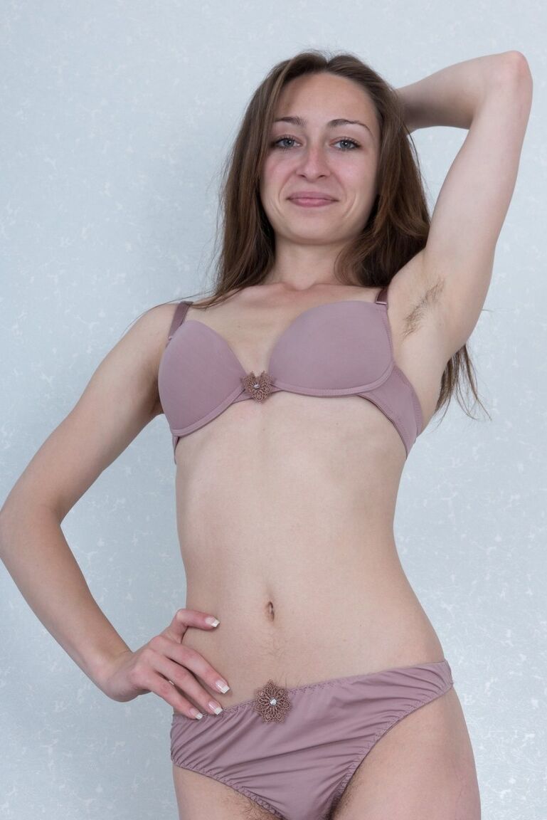 16P Amateur model Morana tugs on the labia lips of her hairy pussy