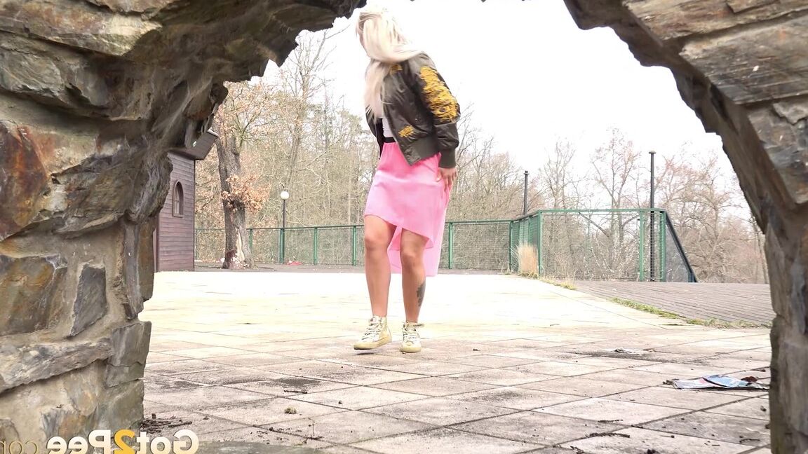 15P Platinum blonde chick squats for a pee in public in gold running shoes