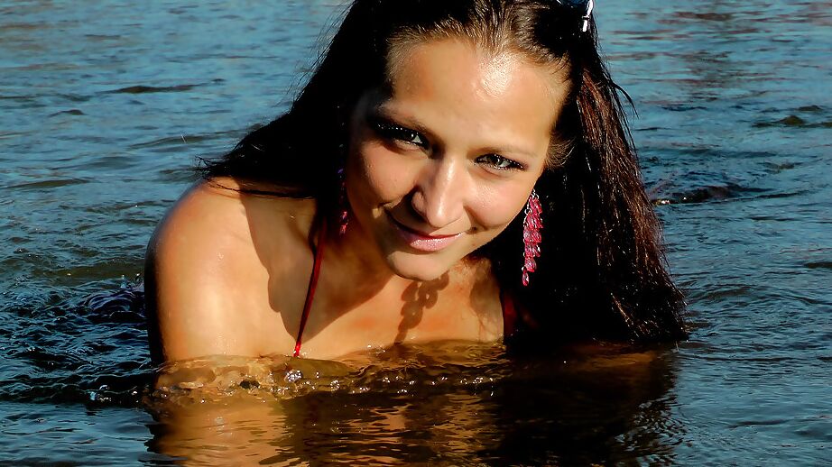 16P Seductive fetish babe Gina Killmer getting her clothes wet in public place