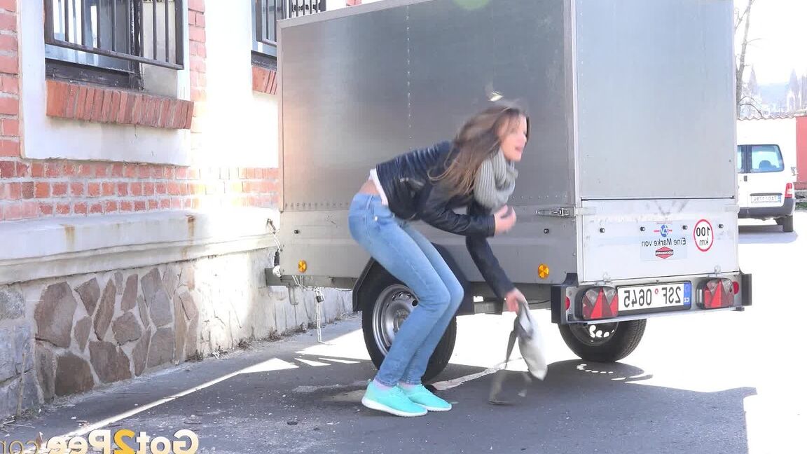 15P Sarah Key can't hold her pee any longer and pisses behind a trailer