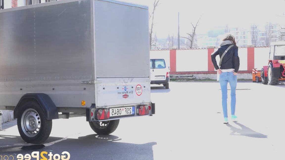 15P Sarah Key can't hold her pee any longer and pisses behind a trailer